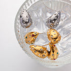 Gold earrings with colorful accent gems for statement style
