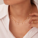 Gold choker necklace with small white pearl charms for women