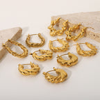 Gold twisted hoop earrings, shiny golden color, women's jewelry