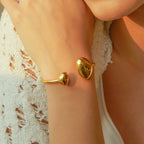 Minimalist gold open cuff bracelet on wrist