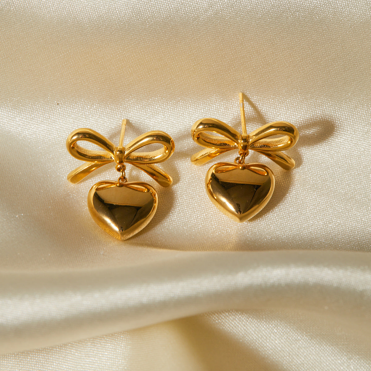 Heart-shaped bow drop earrings all gold tone for women