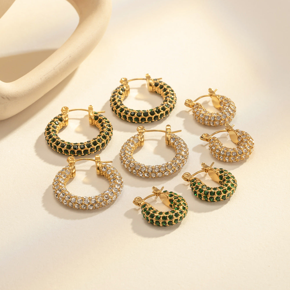 Small Huggie Gold Hoop Earrings with Crystal Accents close up