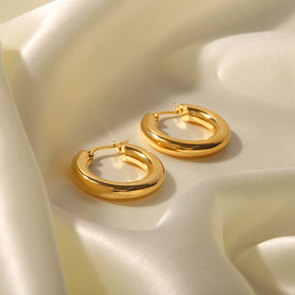 Close-up of Polished Gold Hoop Earrings