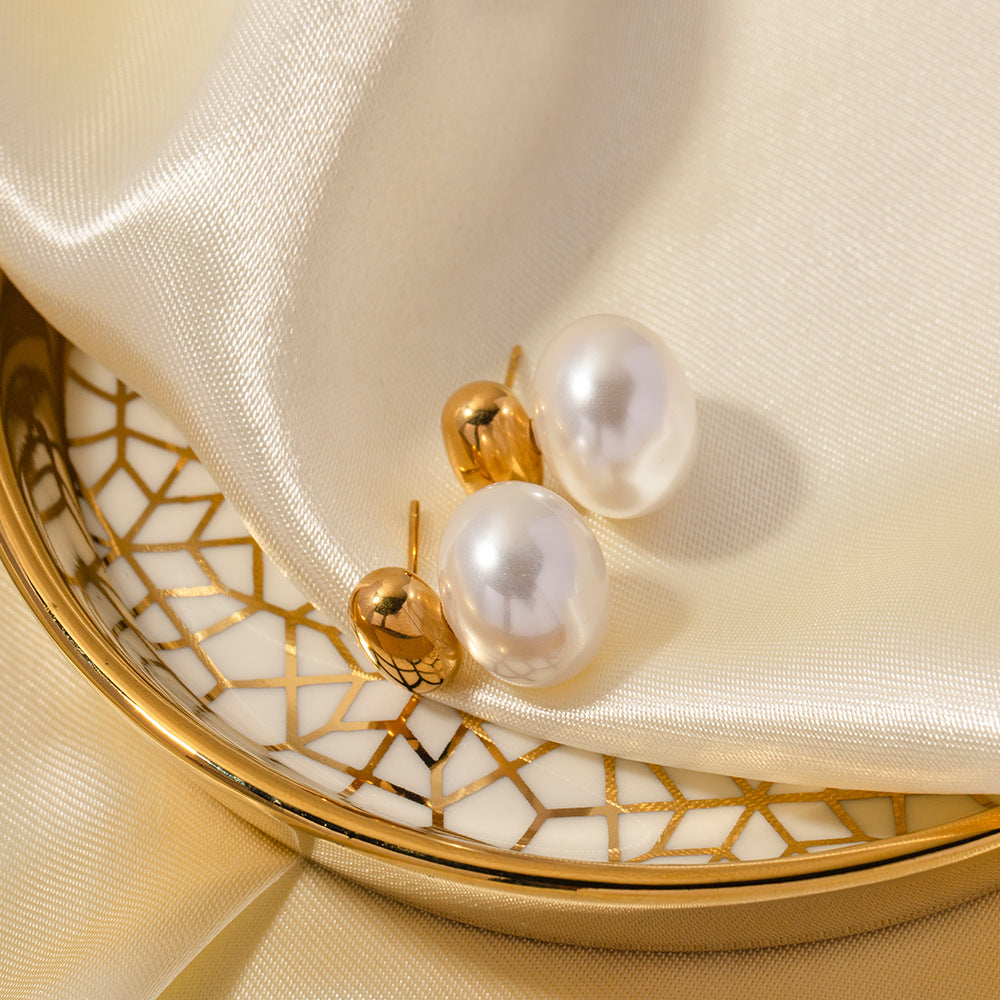 Gold Pearl Drop Stud Earrings on Women's Ear