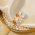 Gold Pearl Drop Stud Earrings on Women's Ear